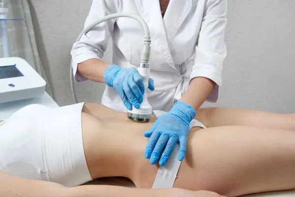 Lost the Weight but Not the Loose Skin? 2 woman having HIFU treatment on her stomach to combat loose skin Brackley following weight loss